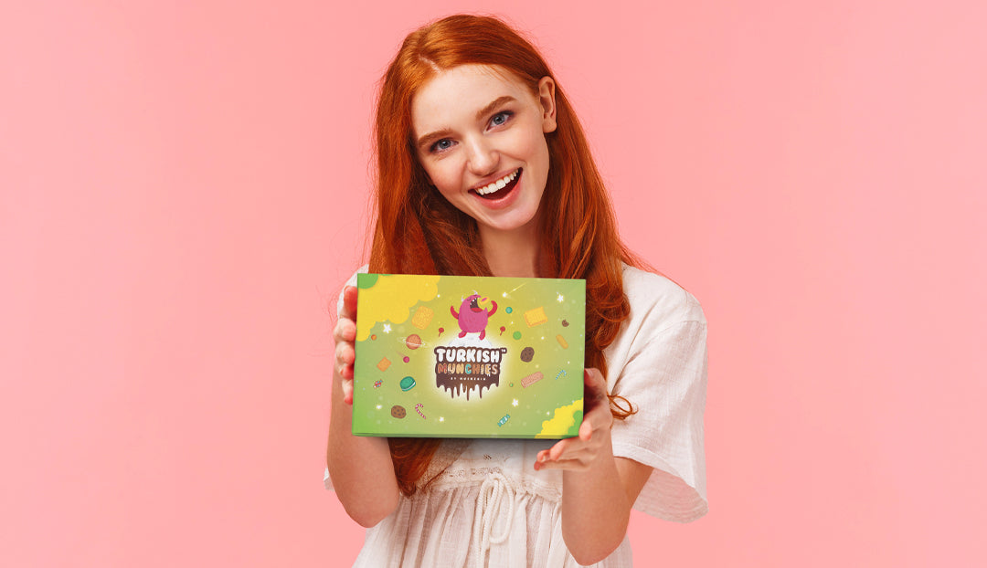 Girl holding the Turkish Munchies Energetic snack box