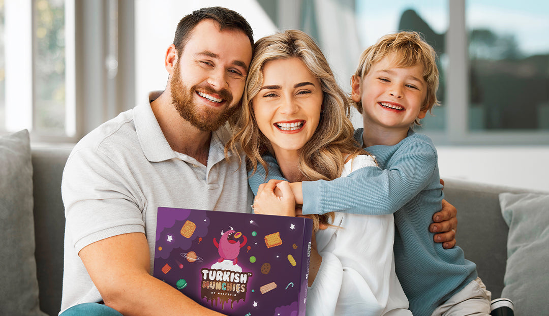 Family holding a Turkish Munchies Exotic snack box