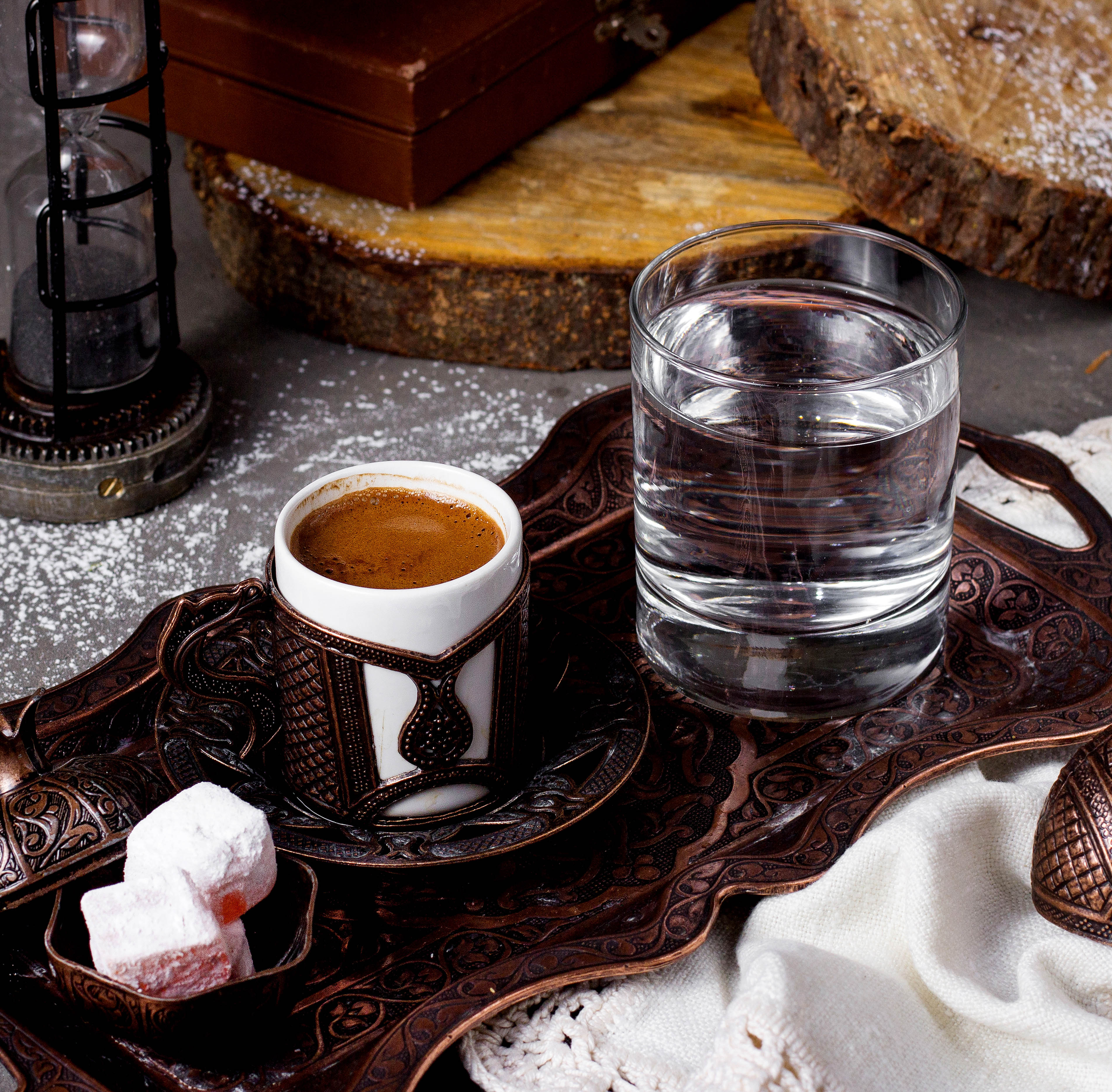 A cup of Turkish coffee, a glass of water and Turkish delights